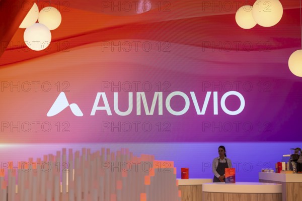Exhibition stand of the company Aumovio. IAA MOBILITY in Munich. The motor show presents itself as a holistic mobility trade fair. Cars continue to take centre stage, however, and Chinese manufacturers are gaining ground. Munich, Bavaria, Germany