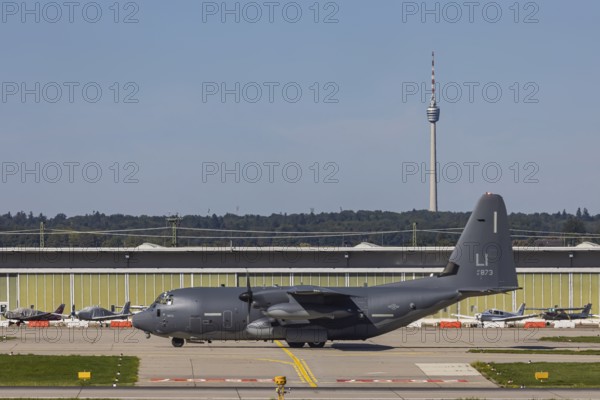 Stuttgart Airport with television tower and Lockheed L-100 Hercules aircraft of the US Air Force. Stuttgart, Baden-Württemberg, Germany