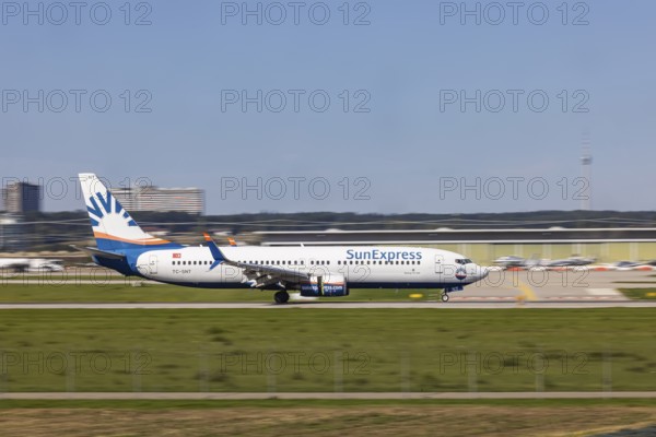 Stuttgart Airport with aircraft on the runway. Aircraft registration number: TC-SNT, SunExpress, Boeing 737-800, Stuttgart, Baden-Württemberg, Germany