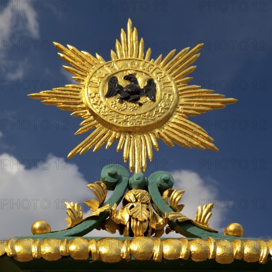 Golden star with black eagle and the Latin inscription suum cuique, to each his own, detail on the fence, Charlottenburg Palace, Berlin, Germany