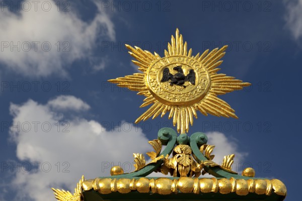 Golden star with black eagle and the Latin inscription suum cuique, to each his own, detail on the fence, Charlottenburg Palace, Berlin, Germany