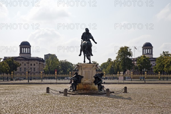 Equestrian statue of the Great Elector in the cour d'honneur of Charlottenburg Palace and the domes of the Stühler buildings, Berlin, Germany