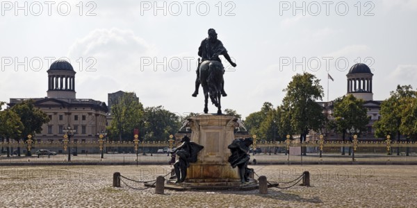 Equestrian statue of the Great Elector in the cour d'honneur of Charlottenburg Palace and the domes of the Stühler buildings, Berlin, Germany