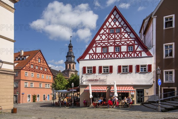 Half-timbered houses with street café and hospital church in the old town, beer town Kulmbach, Maintal, Upper Franconia, Franconia, Bavaria, Germany