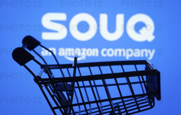 Dhaka, Bangladesh- 03 July 2025: Silhouette of a shopping cart in front of the Souq logo, symbolizing ecommerce and online shopping