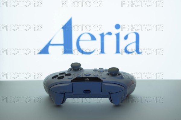 Dhaka, Bangladesh- 23 Sep 2025: Game controller in front of Aeria logo on a background