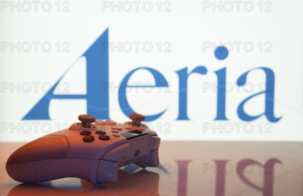 Dhaka, Bangladesh- 23 Sep 2025: Game controller in front of Aeria logo on a background