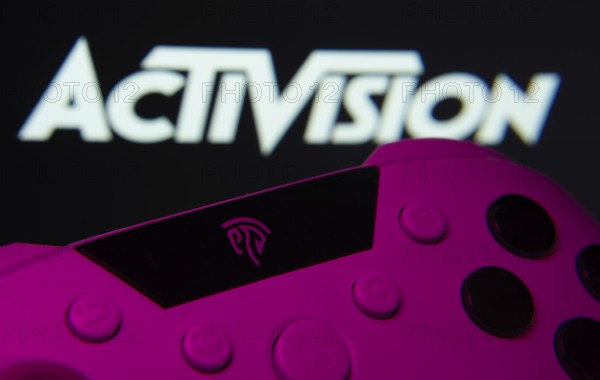Dhaka, Bangladesh- 23 Sep 2025: A close-up of a gamepad with the Activision seen on screen in the background