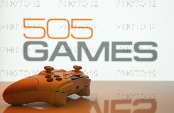 Dhaka, Bangladesh- 23 Sep 2025: Game controller in front of 505 Games logo on a background