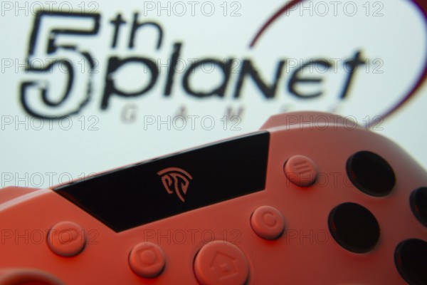 Dhaka, Bangladesh- 23 Sep 2025: A close-up of a gamepad with the 5th planet games seen on screen in the background