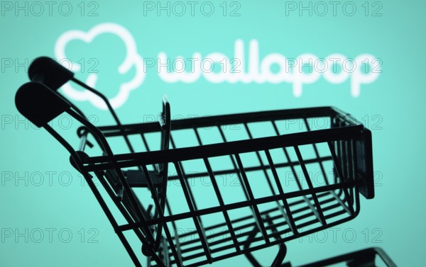 Dhaka, Bangladesh- 03 July 2025: Silhouette of a shopping cart in front of the Wallapop logo, symbolizing ecommerce and online shopping