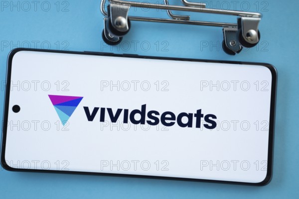 Dhaka, Bangladesh- 03 July 2025: Smartphone screen showing the VividSeats logo with shopping cart wheels on a blue background