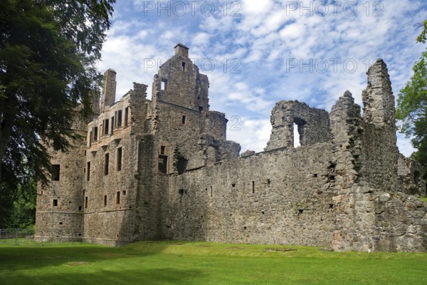 Old castle ruins with crumbling walls on a green meadow under a blue sky, Huntly Castle, Aberdeenshire, Scotland, Great Britain