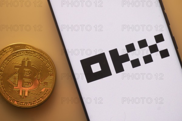A Bitcoin and OKX logo on a white screen with black text