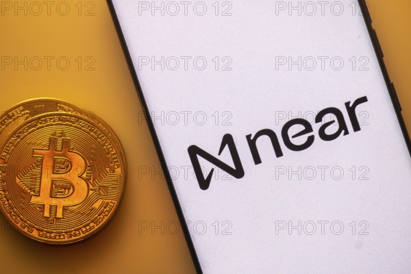 A Bitcoin coin next to a Near logo on a white background