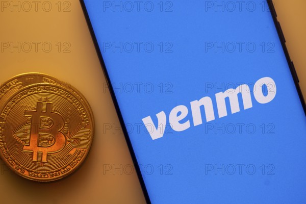 A Bitcoin and Venmo logo on a blue screen representing cryptocurrency