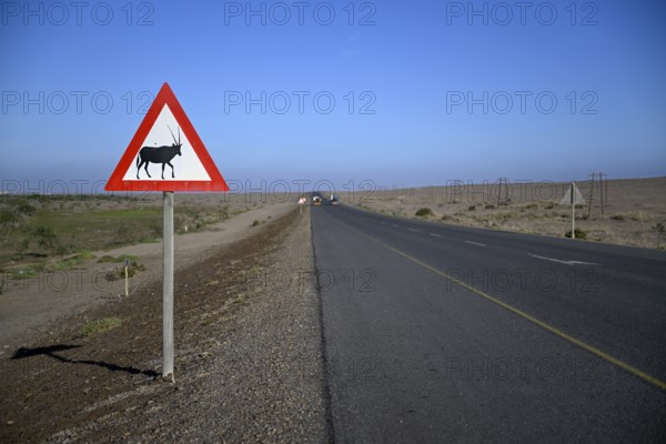 Beware of oryx antelopes (Oryx gazella) sign on a road near Oranjemund, Diamond Sperrgebiet, Karas Region, Namibia