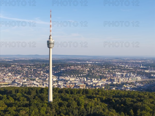 A television tower stands prominently above a vast urban landscape and green forests, Stuttgart, Baden-Württemberg, Germany