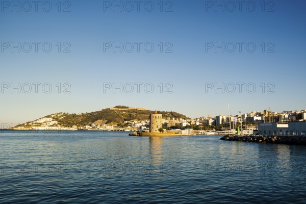 Beautiful view of historic lighthouse by sunset in Ceuta, Spain