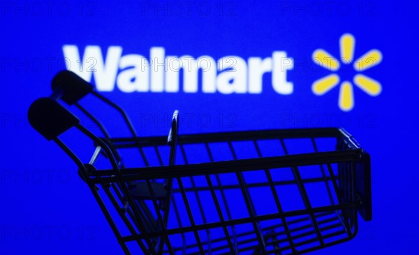 Dhaka, Bangladesh- 03 July 2025: Silhouette of a shopping cart in front of the Walmart logo, symbolizing ecommerce and online shopping