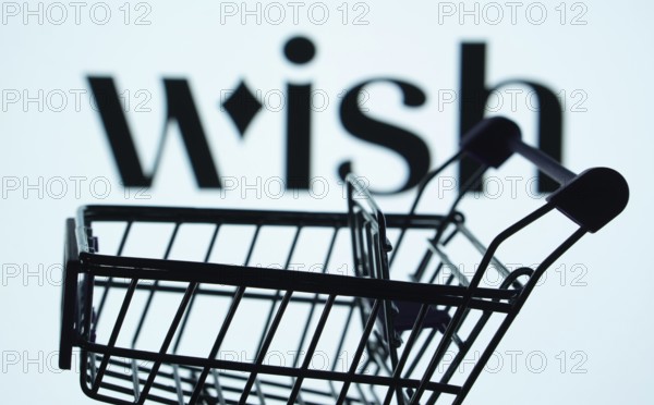 Dhaka, Bangladesh- 03 July 2025: Silhouette of a shopping cart in front of the Wish logo, symbolizing ecommerce and online shopping