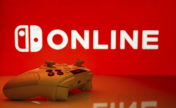 Dhaka, Bangladesh- 15 July 2025: Game controller in front of nintendo online logo on a background