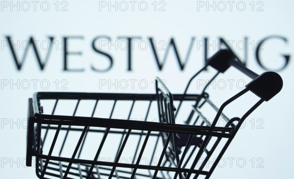 Dhaka, Bangladesh- 03 July 2025: Silhouette of a shopping cart in front of the Westwing logo, symbolizing ecommerce and online shopping