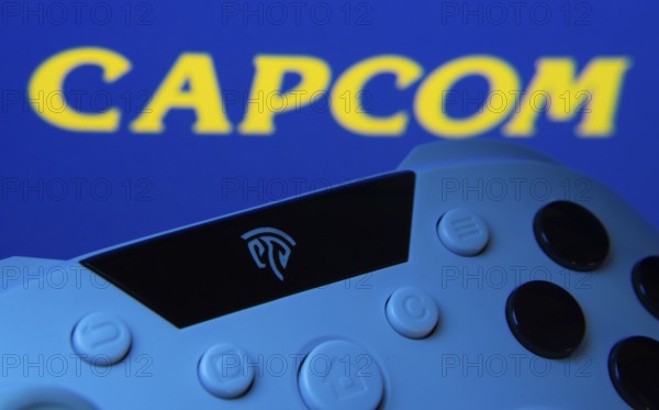 Dhaka, Bangladesh- 15 Sep 2025: A close-up of a gamepad with the Capcom seen on screen in the background