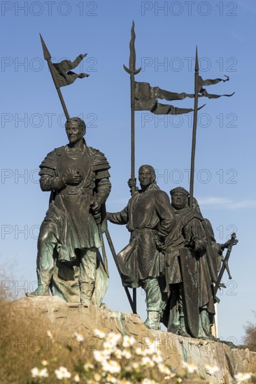 Bronze warrior statues with flags, conveying a historic and majestic feeling, stand against a blue sky, Tulln Weinviertel Lower Austria Austria