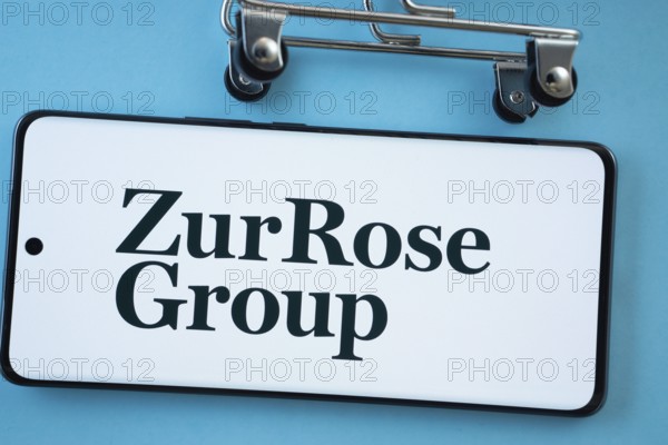 Dhaka, Bangladesh- 03 July 2025: Smartphone screen showing the Zur Rose Group logo with shopping cart wheels on a blue background