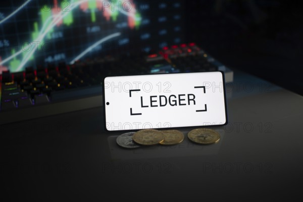 Ledger screen with coins, positioned before a stock chart, lit by neon lights