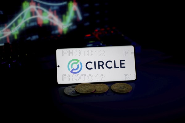 Circle logo highlighted with coins and fluctuating market charts, emphasizing digital trade