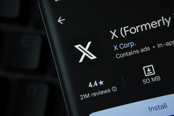 Dhaka, Bangladesh- 27 July 2025: X app from Google Playstore is displayed on a smartphone screen