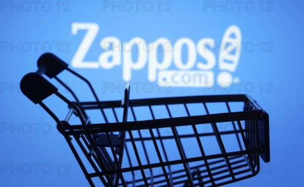 Dhaka, Bangladesh- 03 July 2025: Silhouette of a shopping cart in front of the Zappos logo, symbolizing ecommerce and online shopping