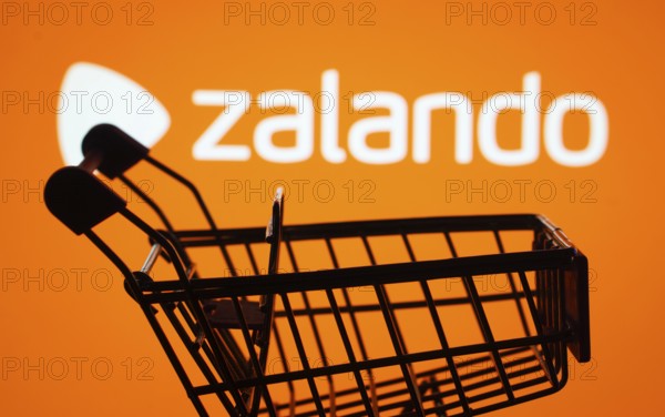 Dhaka, Bangladesh- 03 July 2025: Silhouette of a shopping cart in front of the Zalando logo, symbolizing ecommerce and online shopping