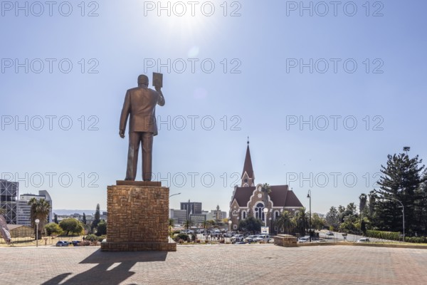 The bronze statue of Dr. Sam Nujoma and Christuskirche is a historic Lutheran church in Windhoek, Namibia - 11 August, 2025
