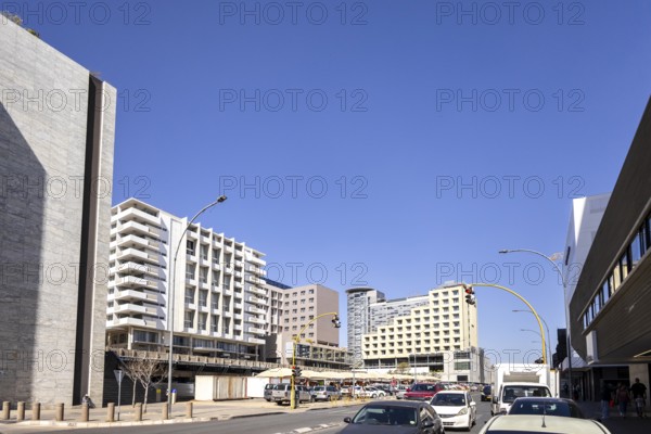 Modern downtown Windhoek, Namibia - 11 August, 2025: with tall contemporary buildings, wide streets, moving cars, and a clear blue sky