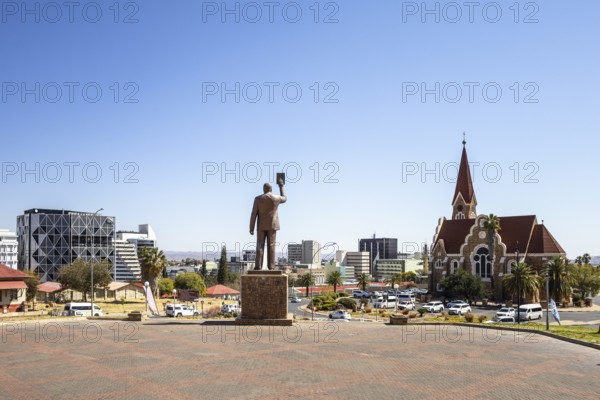 The bronze statue of Dr. Sam Nujoma and Christuskirche is a historic Lutheran church in Windhoek, Namibia - 11 August, 2025