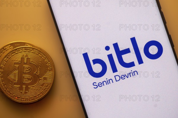 Bitlo displayed on white screen with Bitcoin coin, indicating crypto trading service