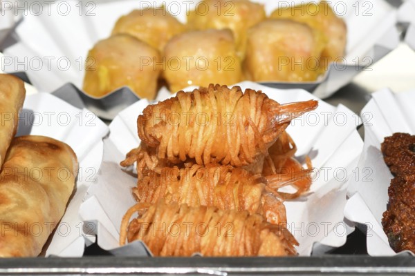 Fried Thai street food potato noodle prawns on small trays