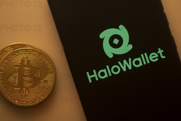 Bitcoin coin alongside phone showcasing HaloWallet logo on black background