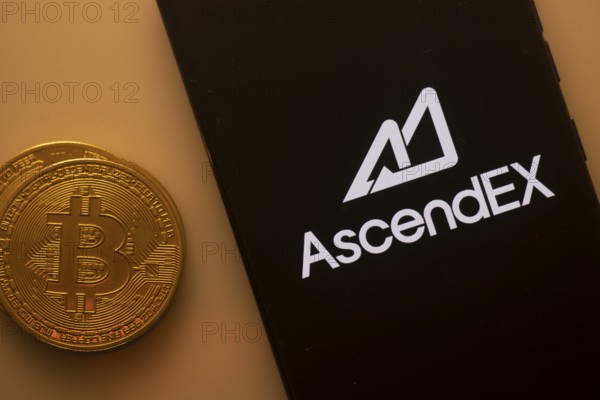 Bitcoin coin beside AscendEX logo on a black background, reflecting crypto trading