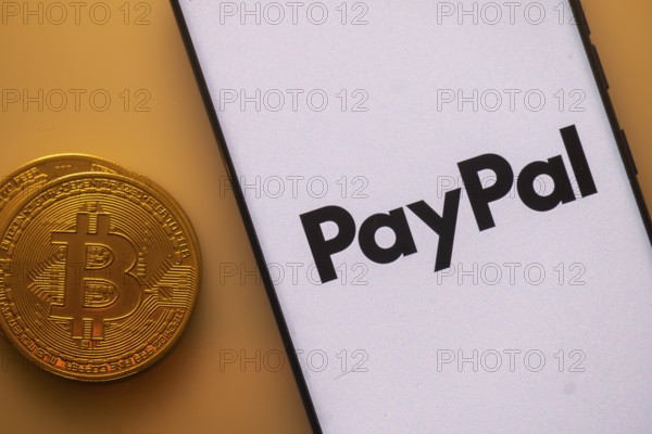 Bitcoin coin beside PayPal logo on a white background, symbolizing digital transactions