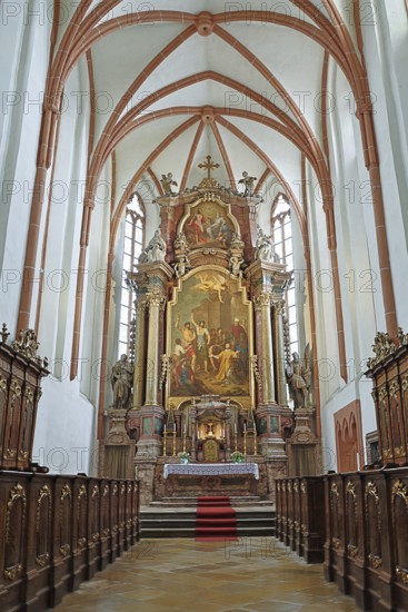 Majestic church altar with detailed woodwork and high ceiling structures, parish church of St.Stephan Tulln Lower Austria Austria
