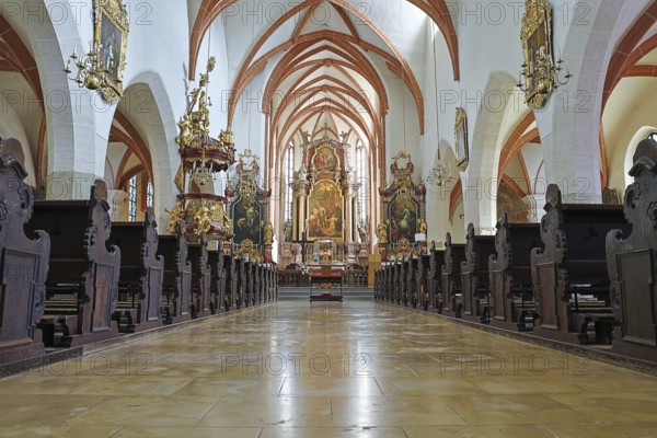 Magnificent church interior with richly decorated ceiling, altar area and ornate sculptures, St.Stephan's parish church in Tulln Lower Austria Austria