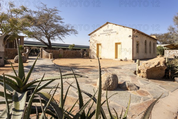 Solitaire Immanuel Church in Namibia - 27 Augusto, 2025: a small desert church surrounded by golden sand dunes and rugged mountains
