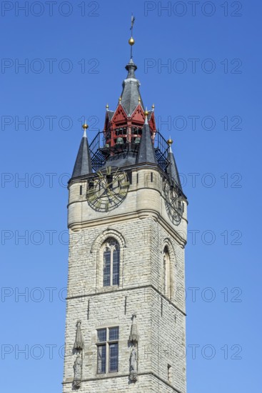 Close-up of 14th century Gothic belfry tower with carillon and clock in the historic city centre of Dendermonde, Termont, East Flanders, Belgium