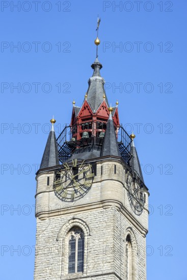 Close-up of 14th century Gothic belfry tower with carillon and clock in the historic city centre of Dendermonde, Termont, East Flanders, Belgium