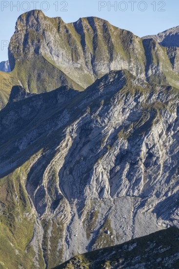 Layer folds in limestone, behind it the Schneck, 268m, Daumengruppe, Allgäu Alps, Allgäu, Bavaria, Germany