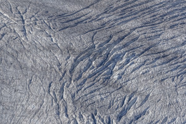 This view shows the ice surface with many crevasses. Distinct details reveal the effects of time and climatic conditions. Impressive natural wonder. Gorner Glacier, Zermatt, Valais, Alps, Swiss